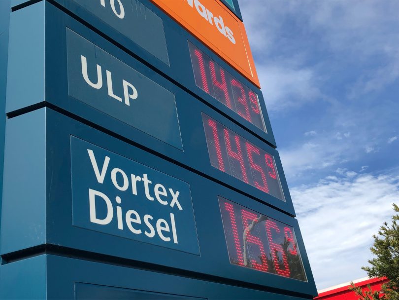 Sign with fuel prices at petrol station