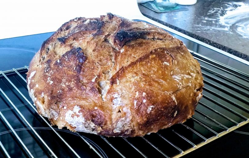 Freshly-baked loaf of sourdough bread
