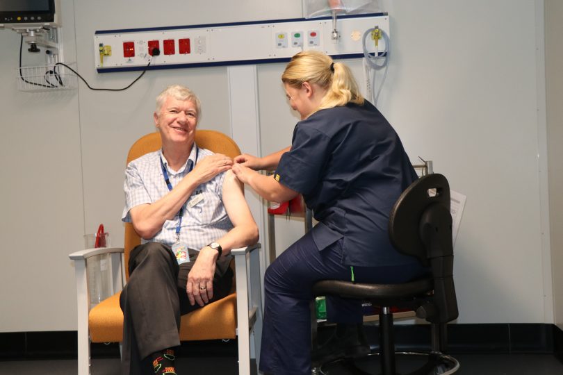 Dr Paul Craft receiving COVID-19 vaccine.