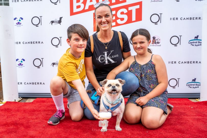 A mother and two children with dog at BarkFest