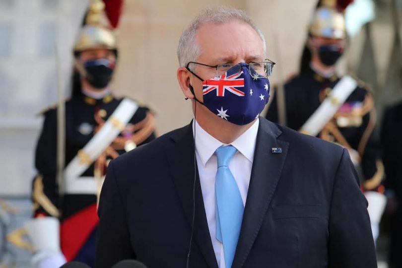 Prime Minister Scott Morrison wears an Australian flag face mask