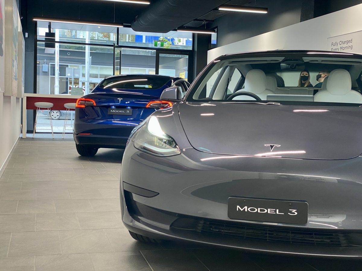 Two Tesla cars in a showroom