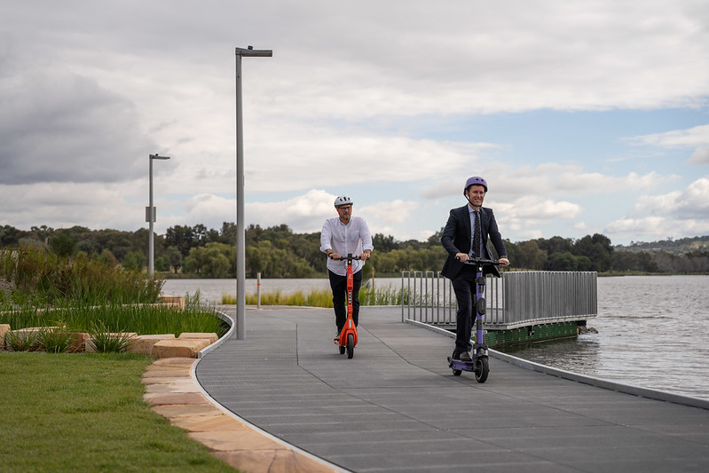 Adam Muirson and Chris Steel on e-scooters in Belconnen