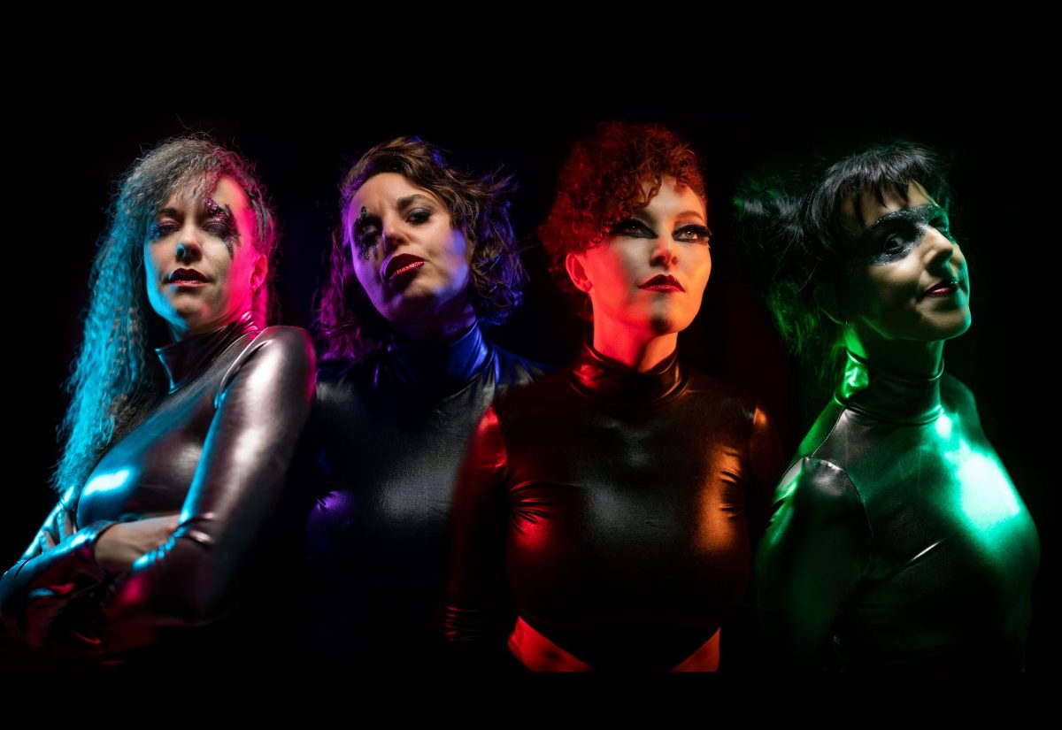 Four women in futuristic costumes
