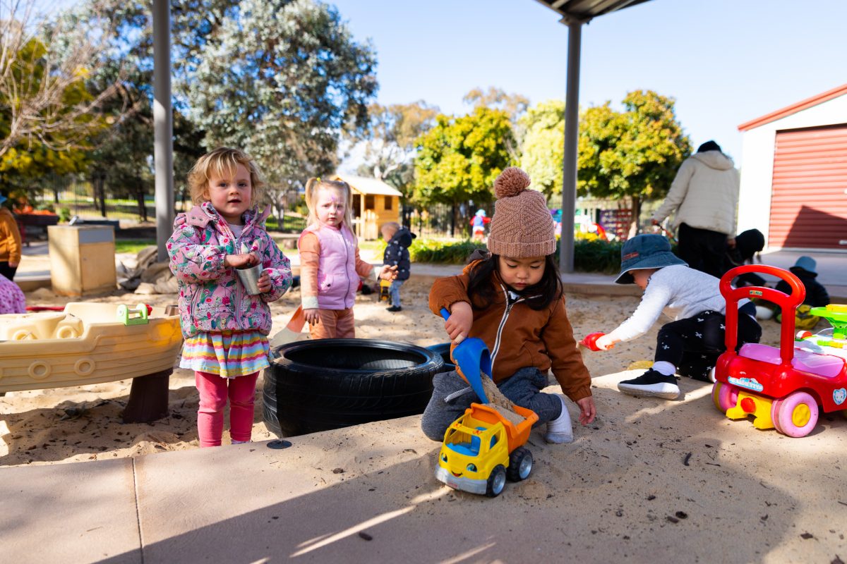 Children play in a sandbox