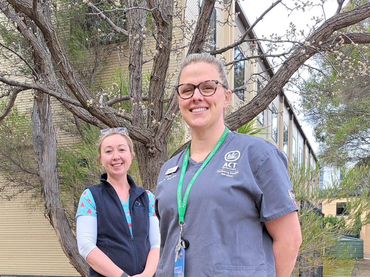 Two nurses outside a hospital