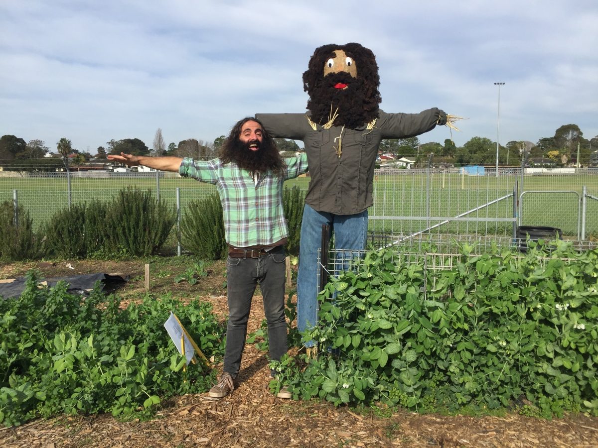 Man with scarecrow