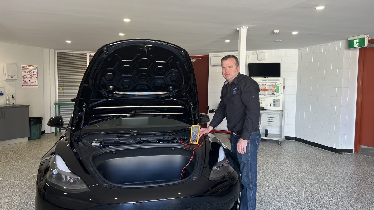 Richard Lindsay with a Tesla 
