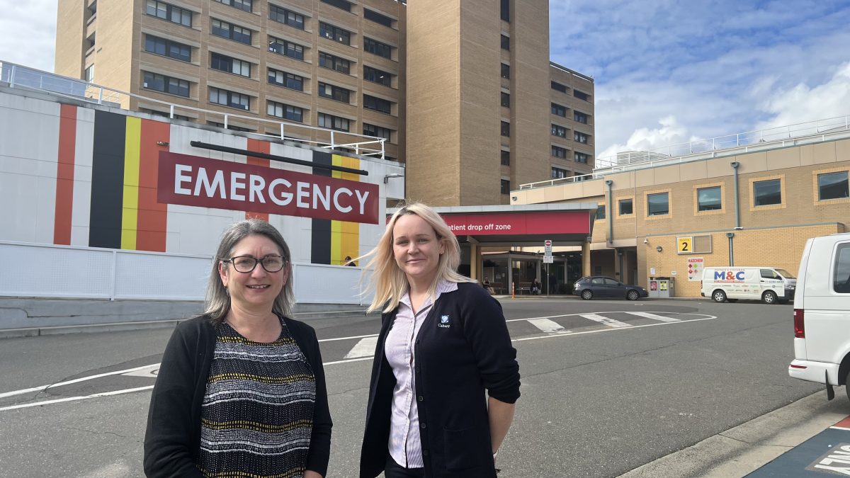 Two women outside hospital