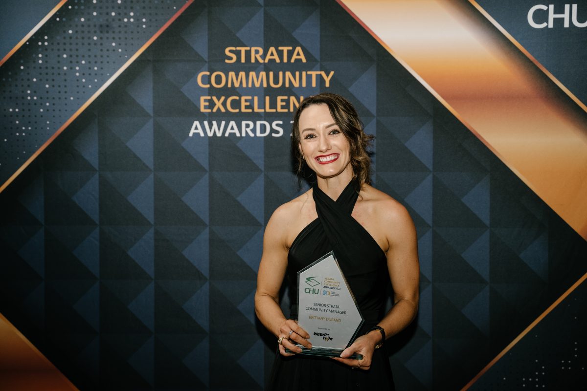 Vantage Strata's Brittany Durand holding her award at the 2022 ACT CHU SCA Strata Community Awards