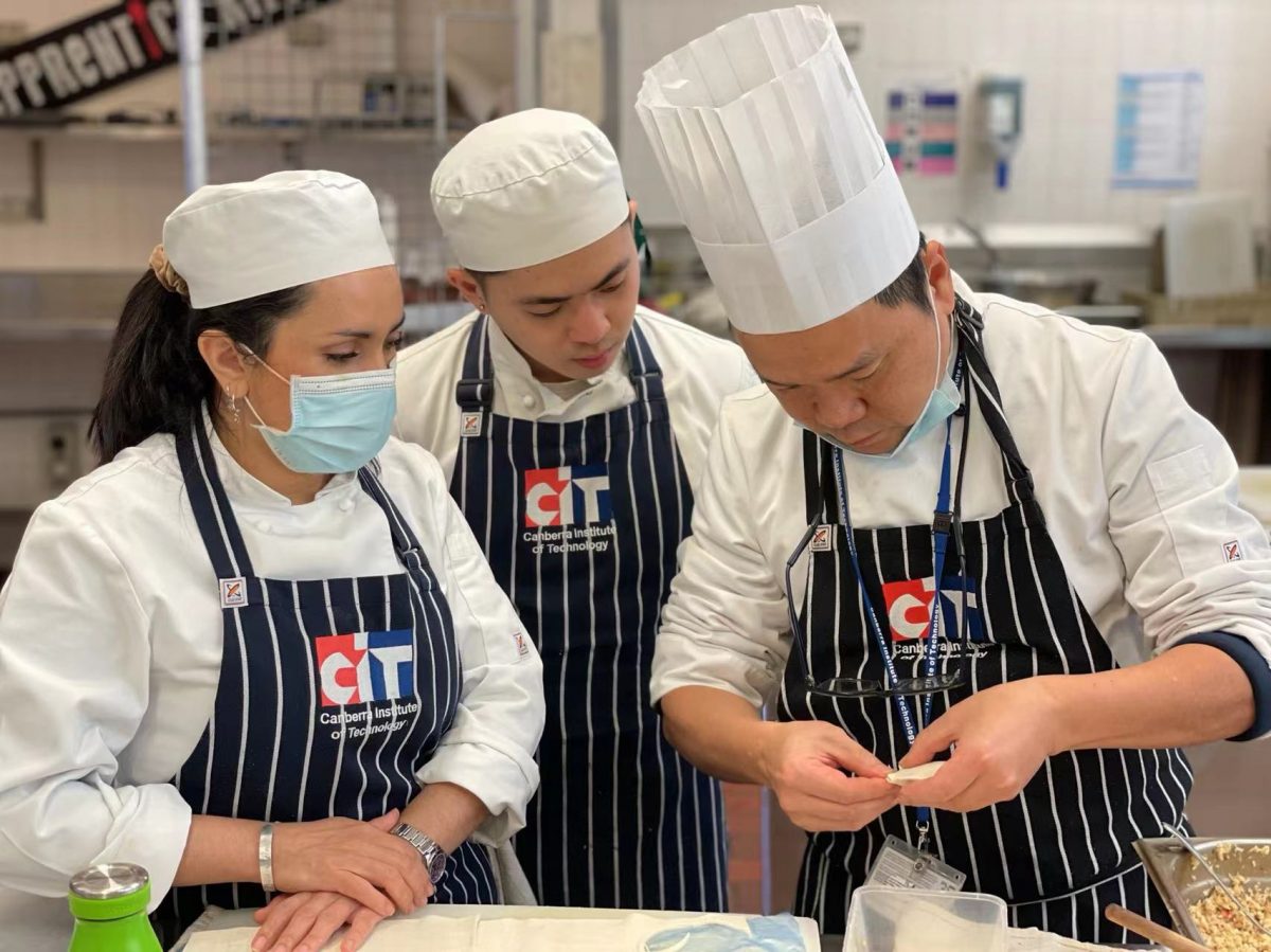 CIT Culinary skills teacher Zhou Chen teaches students some of his craft.